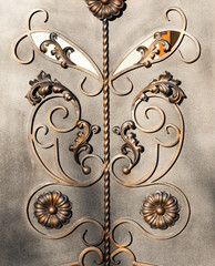 Forged items on gray metal gates