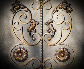 Forged items on gray metal gates