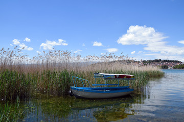 Fototapeta na wymiar Boat moored in Ohrid Lake. Ohrid Town, Macedonia.