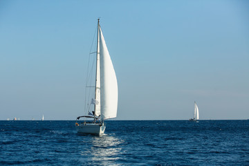 Fototapeta na wymiar Sailing yachts regatta in Aegean sea. Luxury vacation.