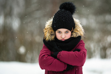 Ten-year-old girl enjoys outdoor in amazing winter.