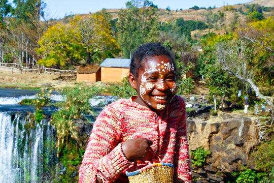 Girl with traditionally painted face, Madagascar