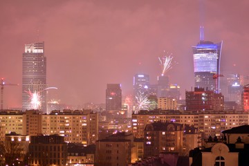 Downtown city at night. New Year's Eve fireworks