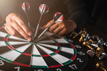 business strategy ideas concept business man hand hold arrow dart and goal board creativity image