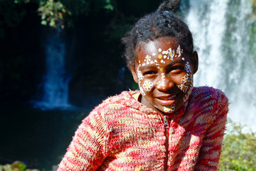 Girl with traditionally painted face, Madagascar