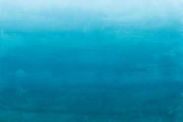 Colorful watercolor ombre leaks and splashes texture on white watercolor paper background. Natural organic shapes and design.