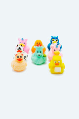 A group of colorful rubber ducks on an isolated white background.
