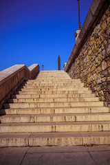 Stone stairways at the center of the city during a sunny day.