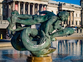 Family of mermaids and dolphin fountain at trafalgar square