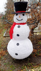 Smiling snowman lawn decoration.