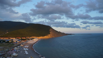 view of sea and mountains sunset