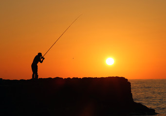 Fisherman at sunset