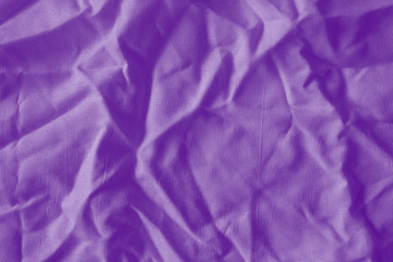 Elegant violet textile background. Silk cloth texture. Fabric pattern.