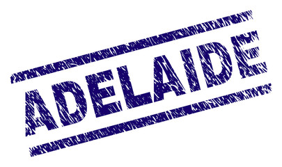 ADELAIDE seal stamp with grunge style. Blue vector rubber print of ADELAIDE label with dust texture. Text label is placed between parallel lines.