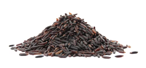 Rolgordijnen Pile of uncooked black rice on white background © New Africa