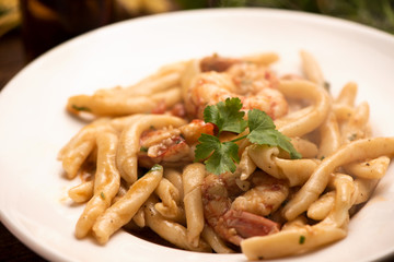 Delicious home made pasta with shrimps. Sicily food on white plate