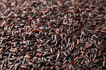 Raw brown rice as background, closeup view