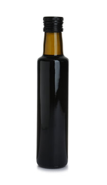 Bottle with balsamic vinegar on white background