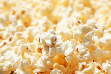 Fresh popcorn as background, closeup. Tasty snack