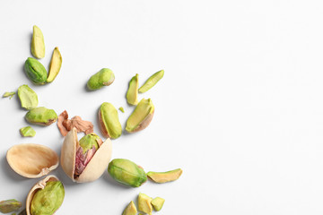 Composition with organic pistachio nuts on white background. Space for text