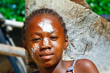 Girl with traditionally painted face, Madagascar
