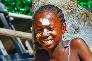 Girl with traditionally painted face, Madagascar