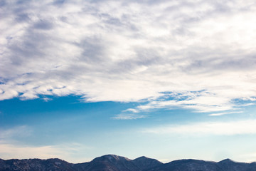 Cloudy sky and mountains.
