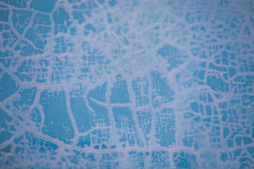 Cracked paint pattern on the blue wall