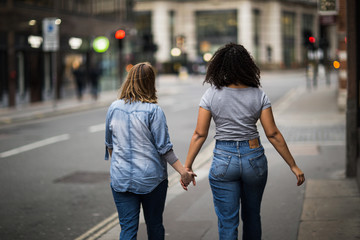 lesbian couple walking down the street