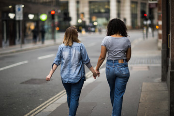 lesbian couple walking down the street
