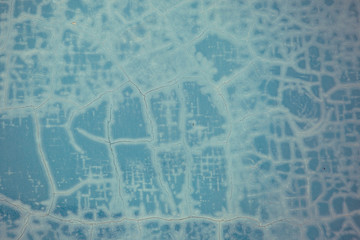 Old wall with emerald cracked paint