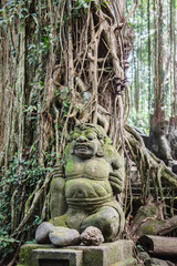 Fototapeta na wymiar Statue in monkey forest of ubud, bali