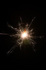 Hand fireworks sparkler on black background.