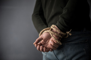 Hands tied up with rope