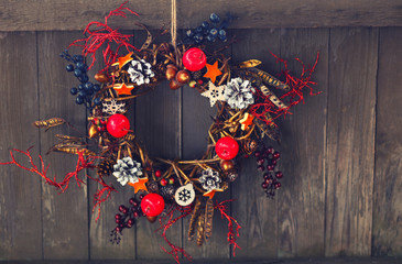 Christmas wreath on the blue rustic wooden background