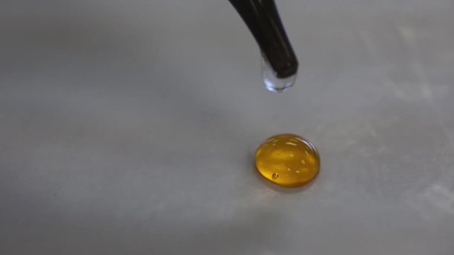 Chemistry laboratory experiment showing spot test for precipitate formation.