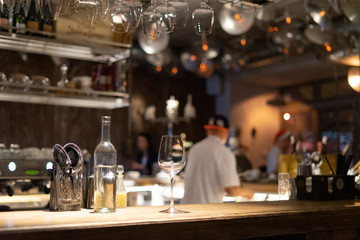 Bar counter with wine glasses and blurry background