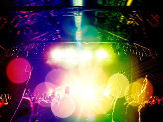Big concert arena with clapping people
