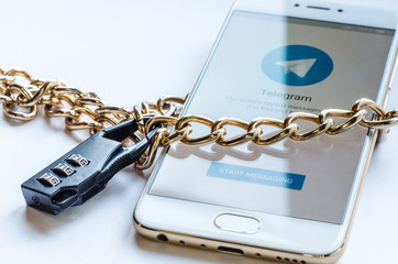 Blocked mesenger telegrams in Russia. The smartphone is chained and locked, as a symbol of private access to software.