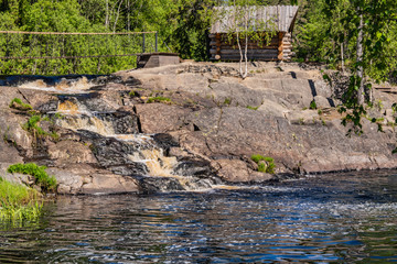 Foamy streams of water Tahmayoki River on the waterfall Ahinkoski