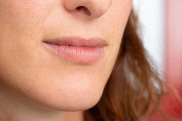 Fototapeta premium Closeup of a beautiful brunette woman's mouth