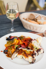 Delicious grilled calamari squid with vegetable on plate