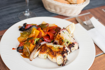 Delicious grilled calamari squid with vegetable on plate