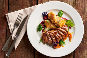 Rosé duck breast with hungarian potato dumplings, baked apple-beetroot cream and orange-pumpkin marmalade