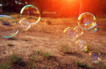 soap bubbles into the sunset with beautiful bokeh.close-up