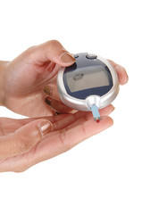 Woman's hands holding a glucometer