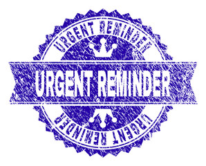 Obraz premium URGENT REMINDER rosette seal overlay with distress texture. Designed with round rosette, ribbon and small crowns. Blue vector rubber watermark of URGENT REMINDER text with unclean style.