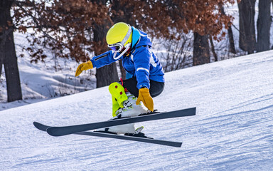 Fototapeta na wymiar People are enjoying half-pipe skiing / snowboarding 