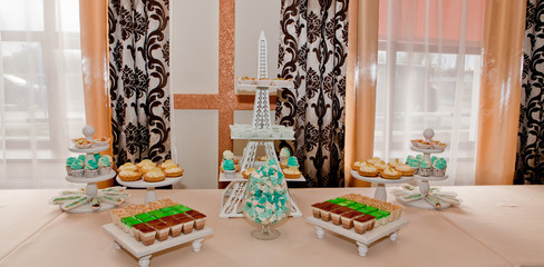 Different fruit desserts with fruits in glasses on the table. Restaurant presentation, food, party concept