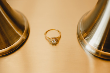 golden wedding rings on a black background